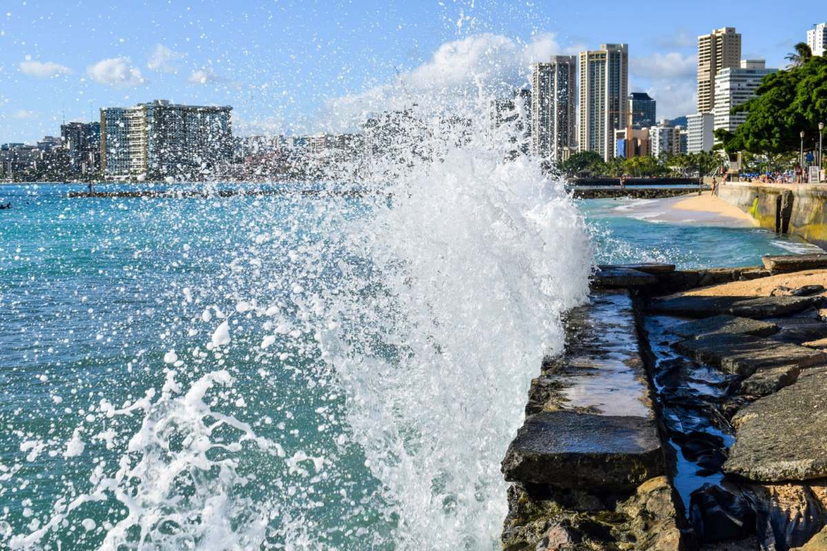 Waves crashing into a seawall.