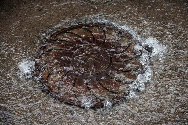 Water flowing out of a manhole.