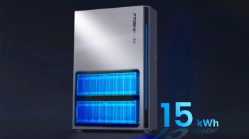 A modern energy storage unit with blue-lit battery compartments and a digital display showing "15 kWh."