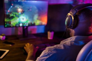 A gamer sitting at a computer.