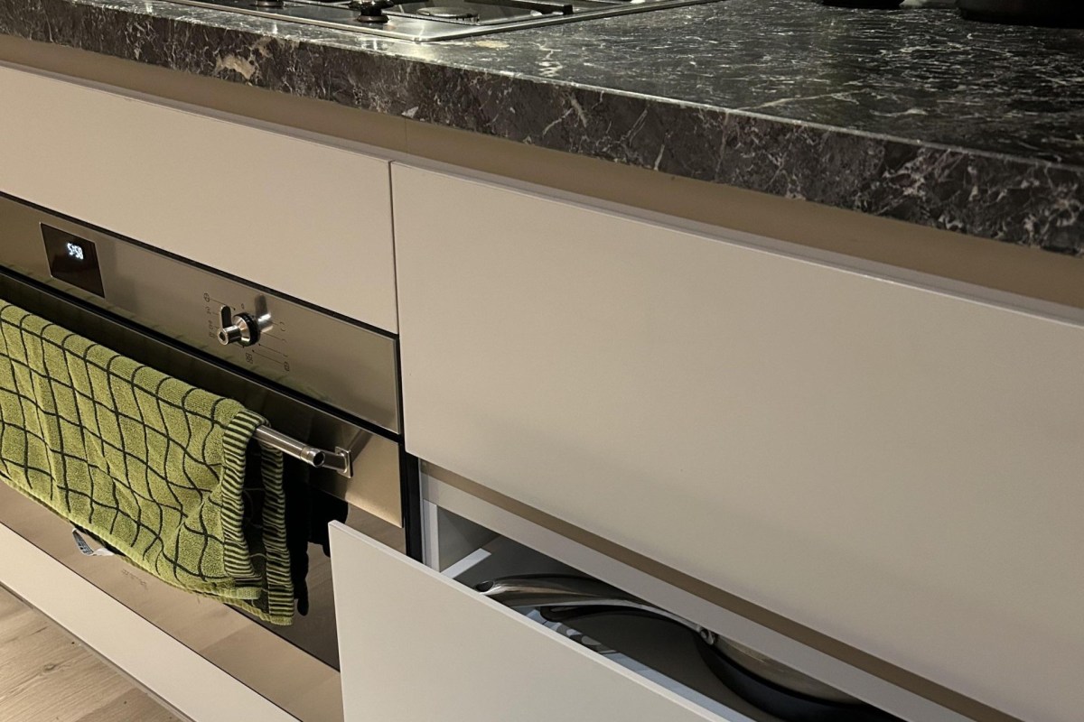 Cabinets next to an oven.