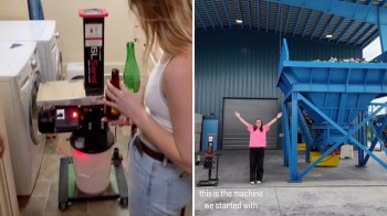 A woman puts a glass bottle into a small machine, then stands between it and a large blue recycling machine.