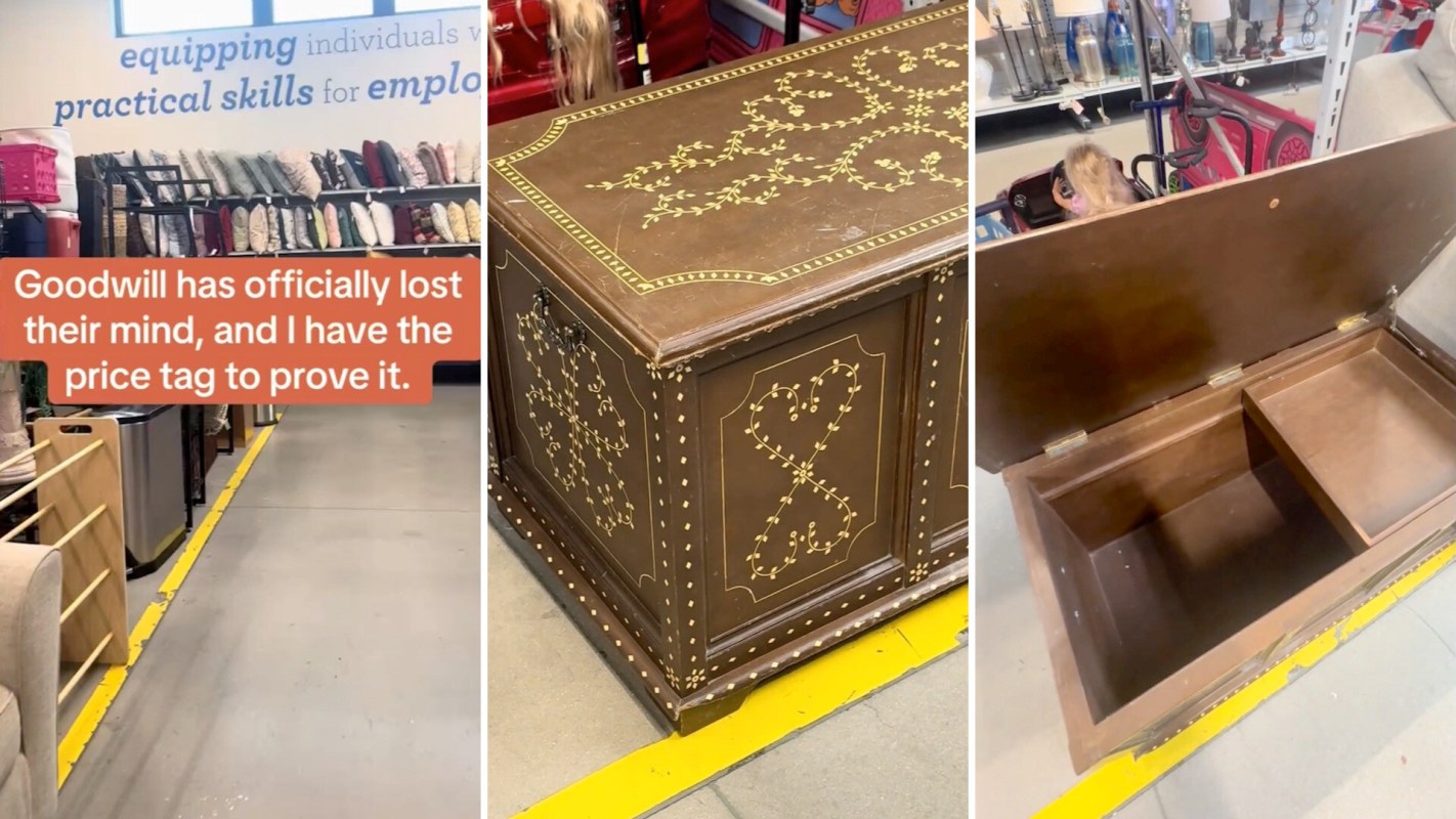 A decorative wooden storage chest with gold embellishments displayed in a Goodwill store.