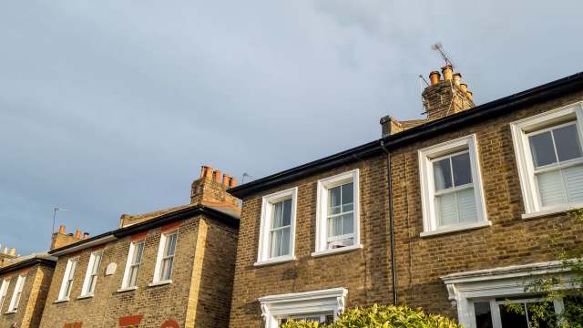 A row of brick residential buildings.