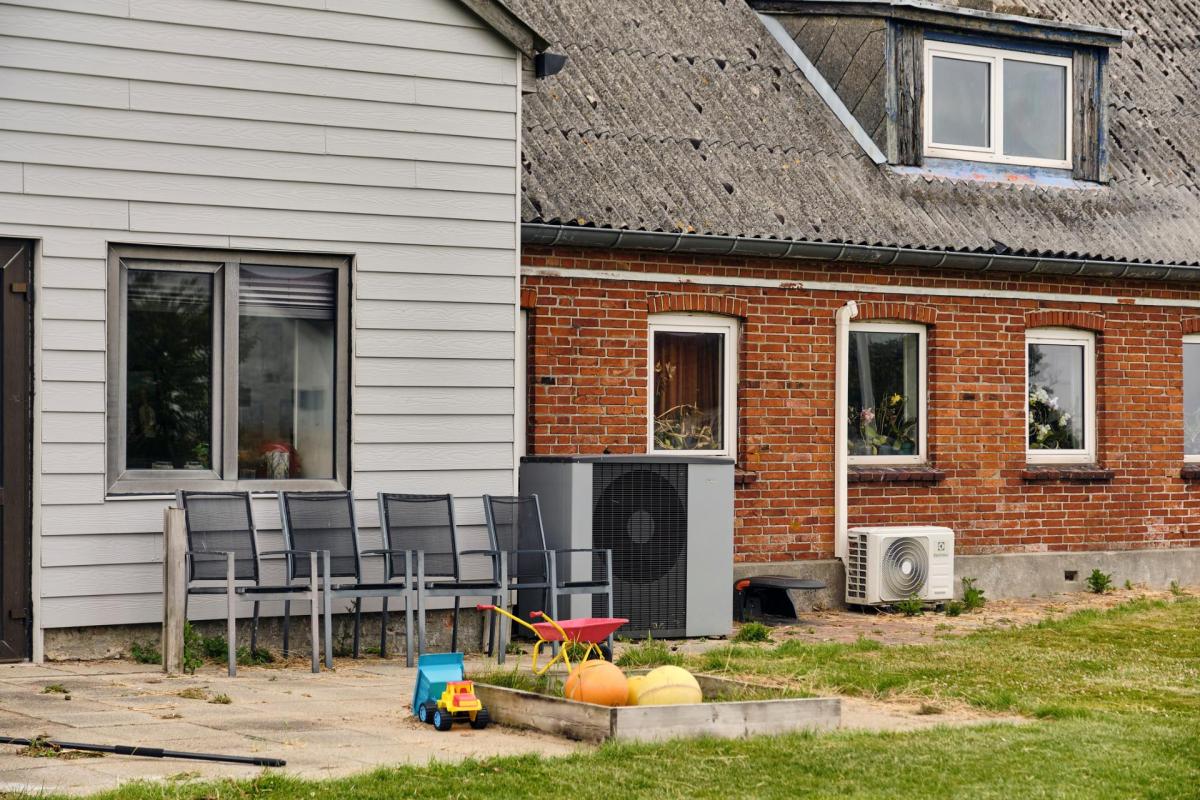 Heat pumps near a farmhouse.