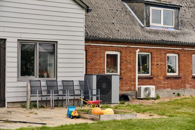 Heat pumps near a farmhouse.