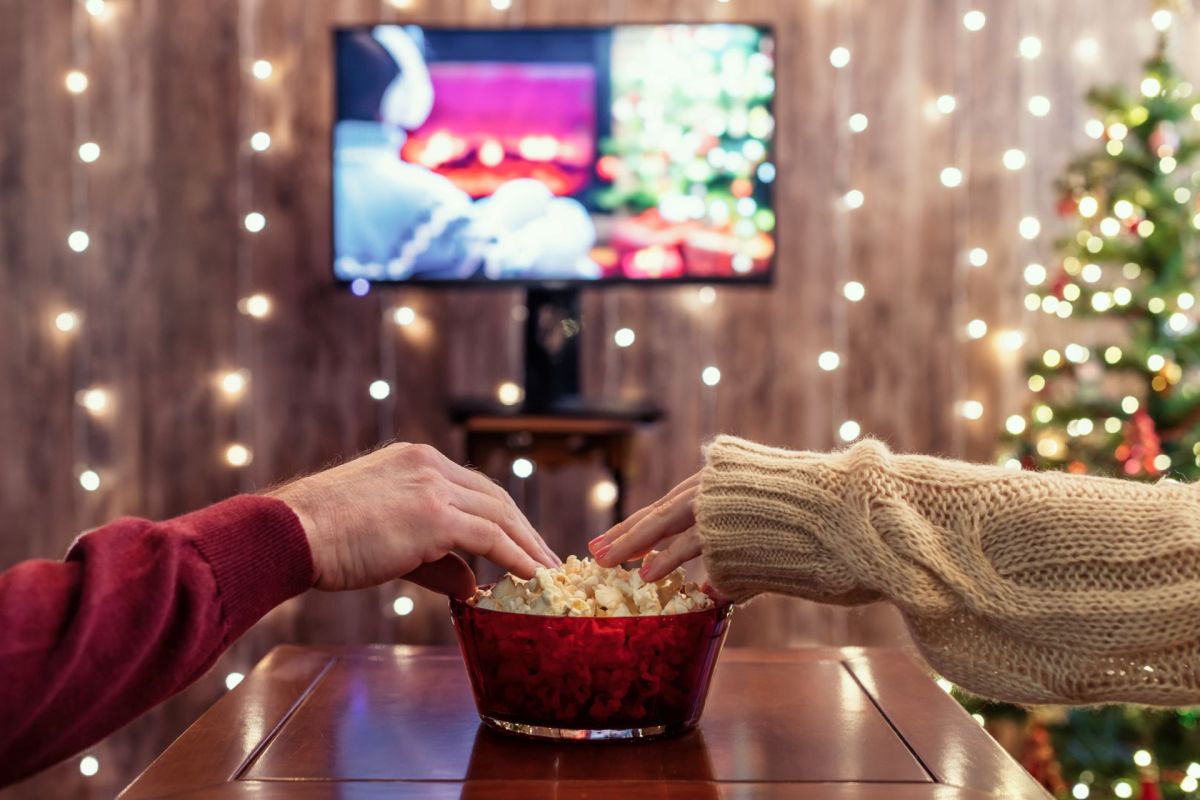 A couple watching TV during the holidays.