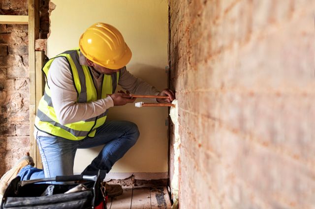 A contractor working on home repairs.