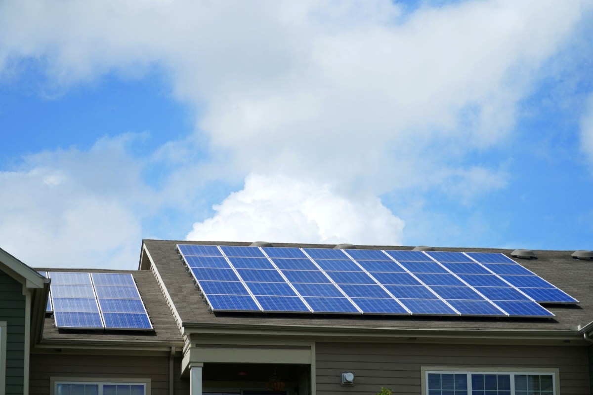 A house with rooftop solar panels.