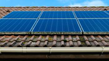 Solar panels installed on a tiled roof.