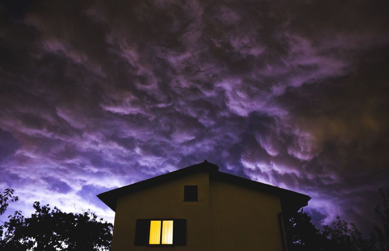 A house under a stormy sky.
