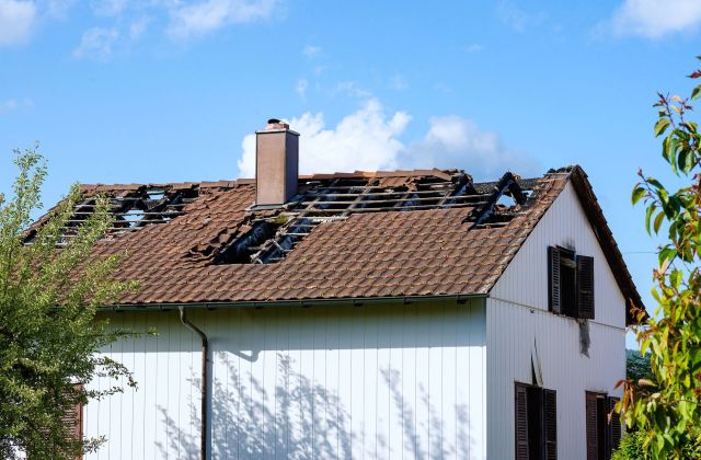 A house with a damaged roof.