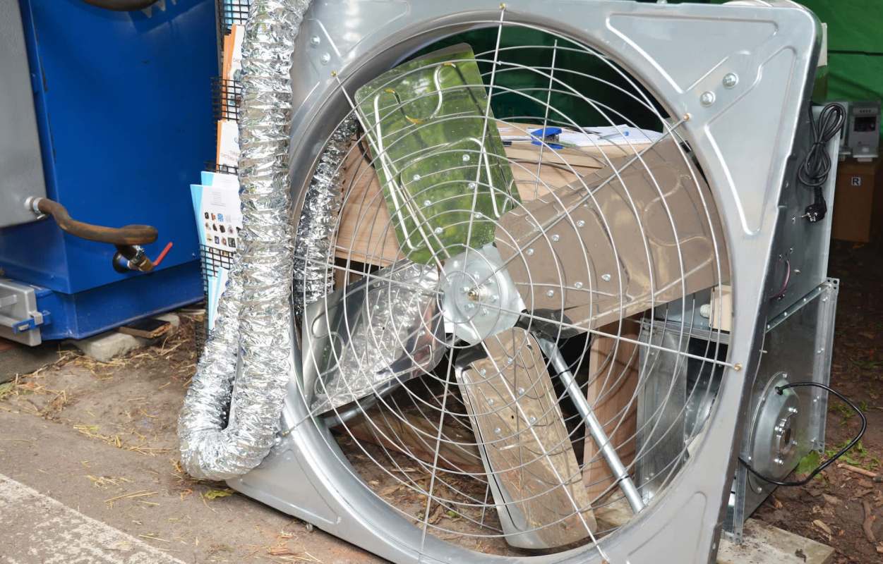 An industrial fan with a metal frame.