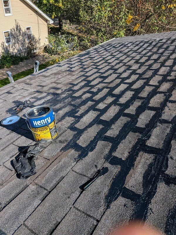 Patching a roof.