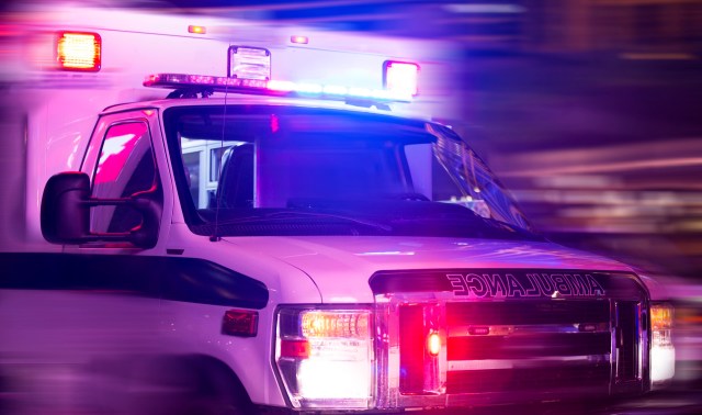 An ambulance with flashing lights.
