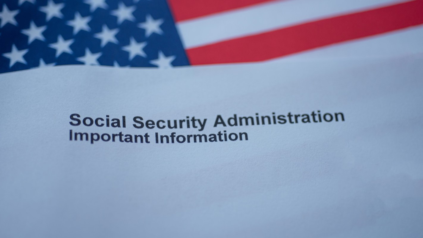A document with the text "Social Security Administration Important Information" on a background of an American flag.