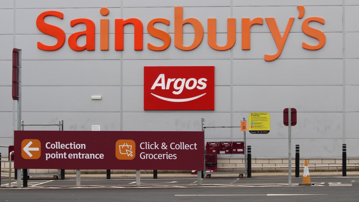 A sign for Sainsbury's and Argos with information about collection points and grocery pickup.