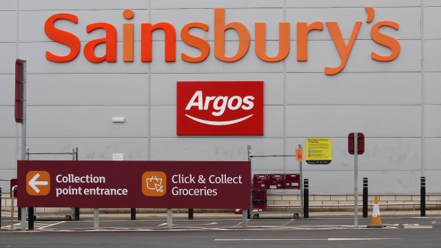 A sign for Sainsbury's and Argos with information about collection points and grocery pickup.