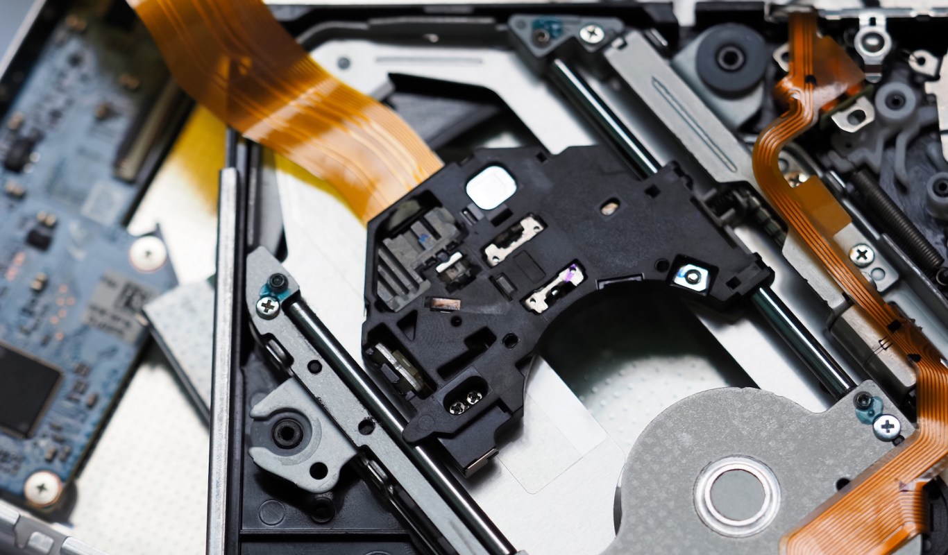 An intricate arrangement of electronic components and connectors inside a CD device.