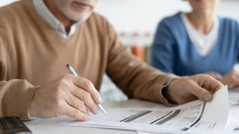 A person reviews documents.