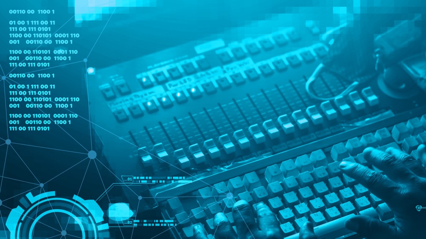 A hand types on a keyboard surrounded by digital data and circuit-like graphics.