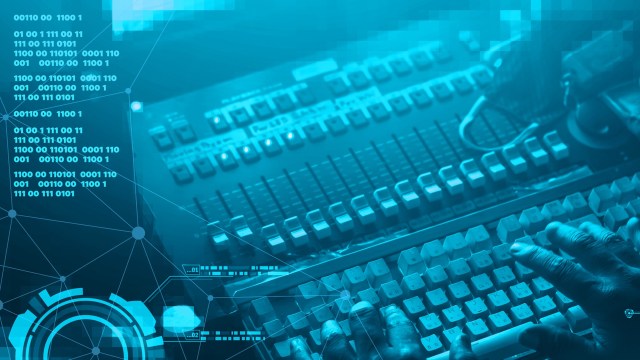 A hand types on a keyboard surrounded by digital data and circuit-like graphics.
