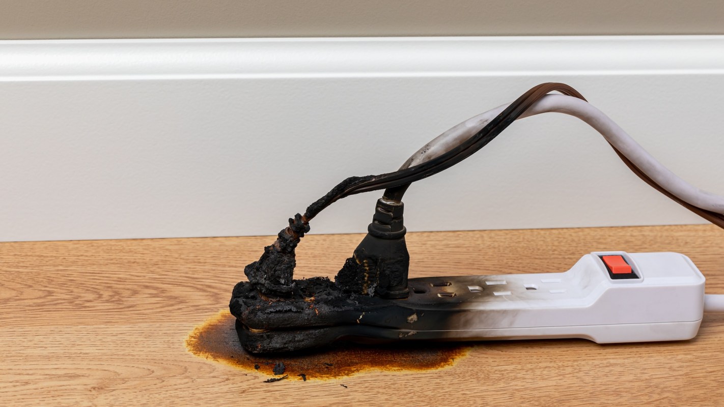 A burnt power cord and extension cord.