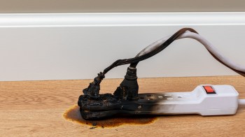 A burnt power cord and extension cord.