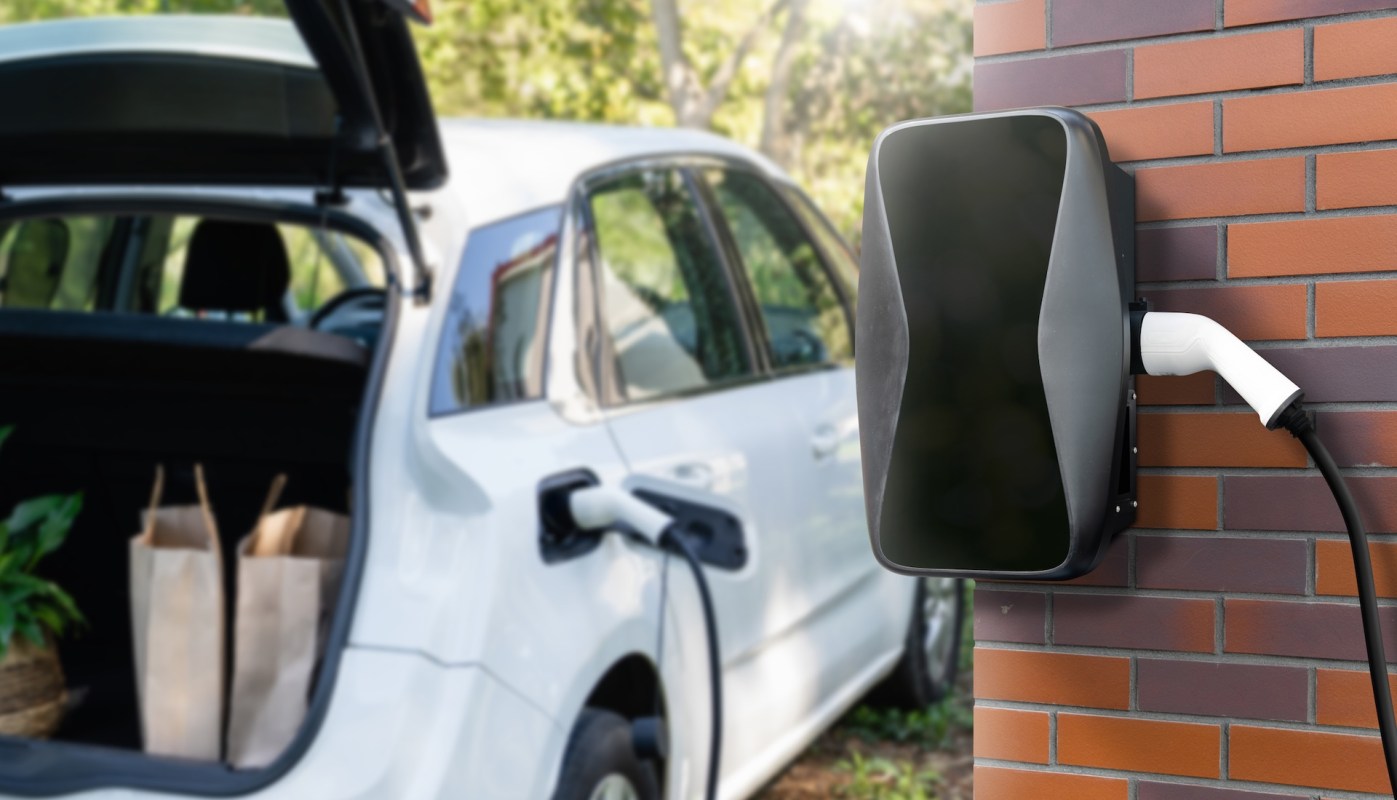 An electric vehicle at a home charging station.