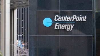The logo for CenterPoint Energy displayed on a dark wall.