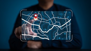 A person interacting with a digital map.