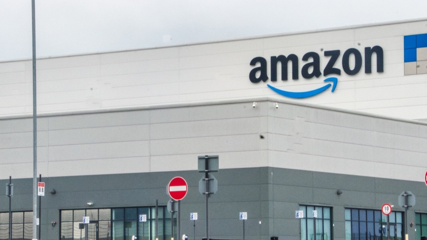 An Amazon data center exterior with signage and parking restrictions visible.