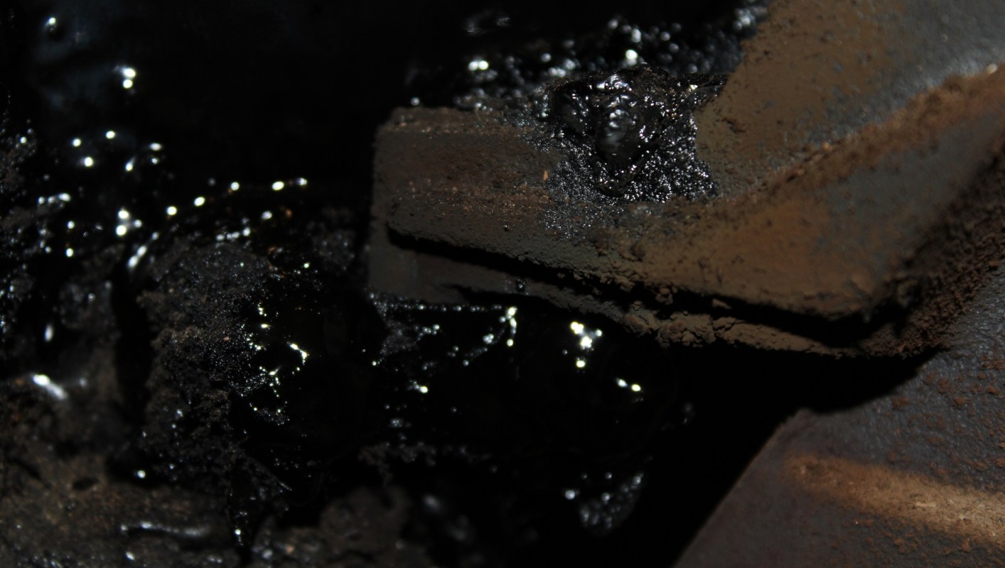 Dark, oily residue.