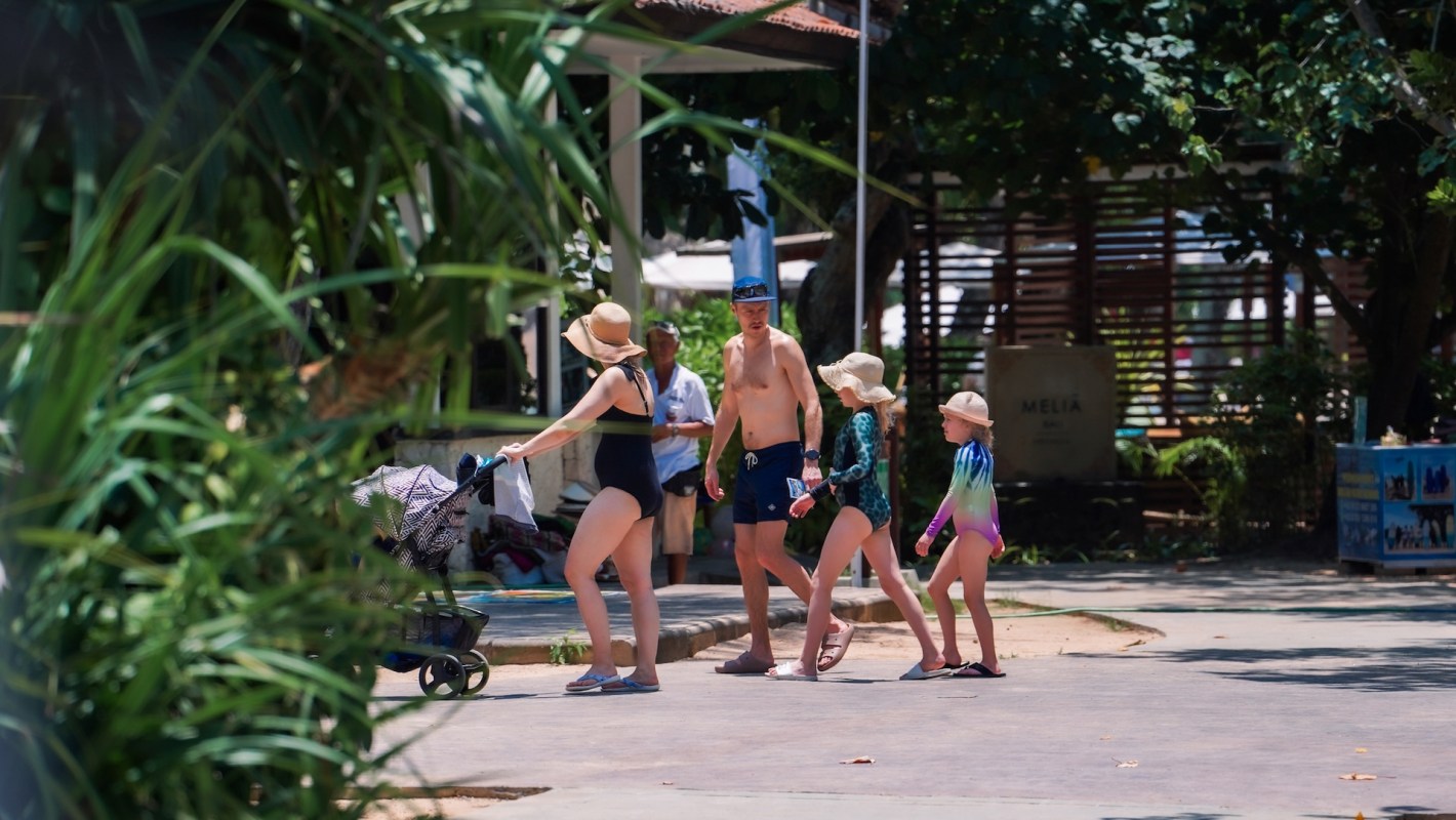 A family at a pool.