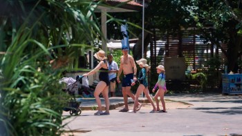 A family at a pool.