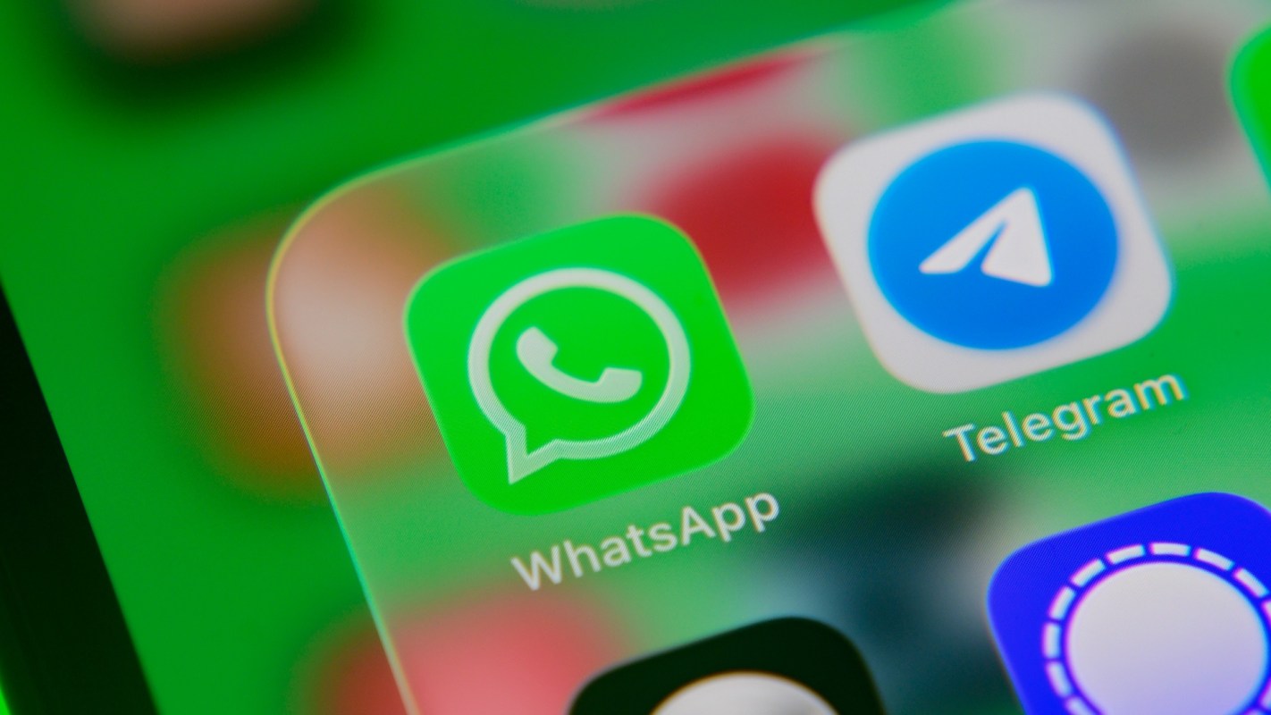Icons of WhatsApp and Telegram applications on a smartphone screen.