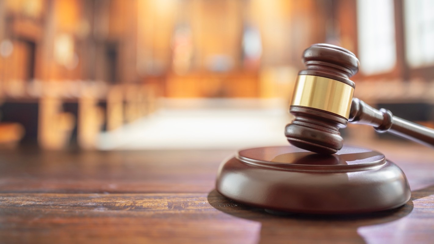 A gavel on a desk.