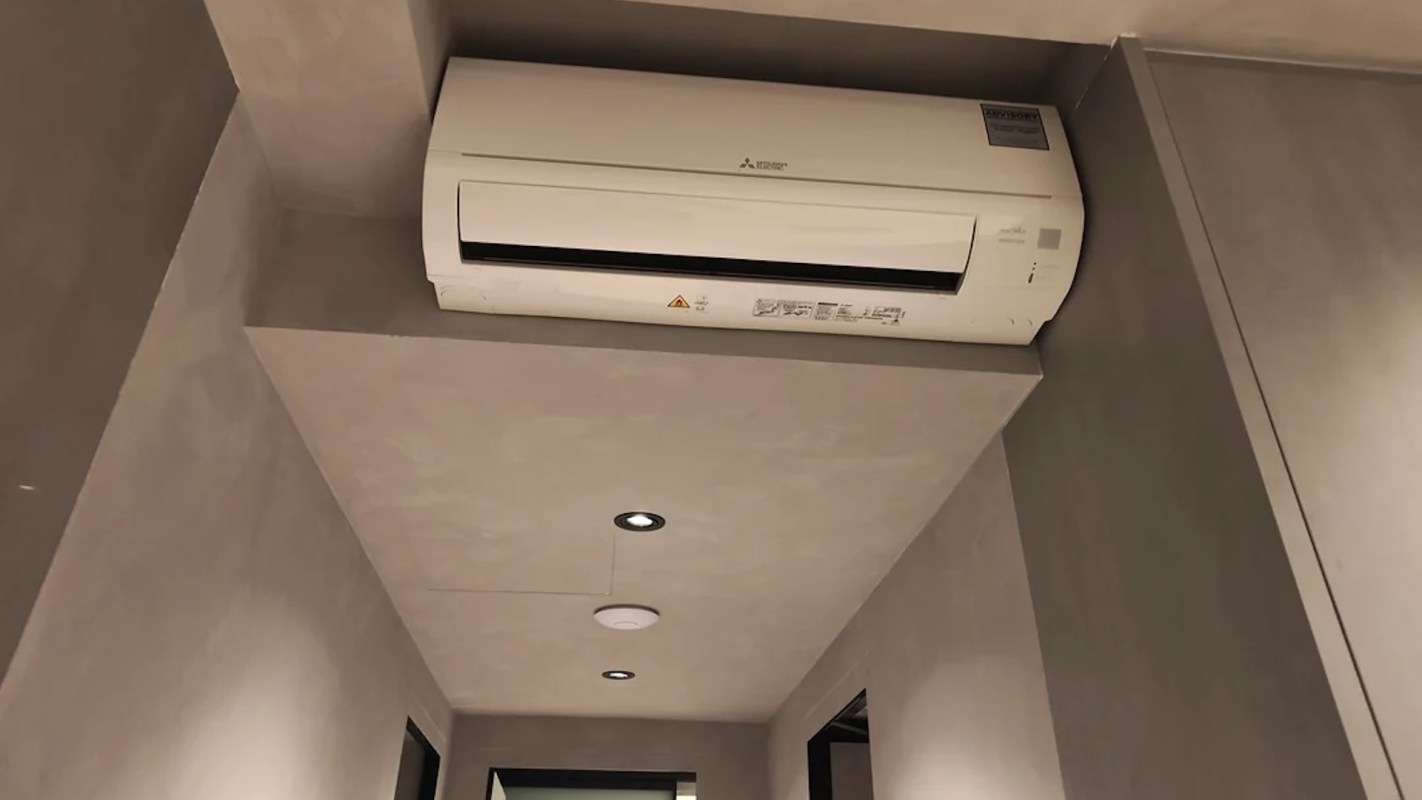 A mini-split unit mounted in a tight space.