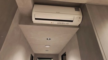 A mini-split unit mounted in a tight space.