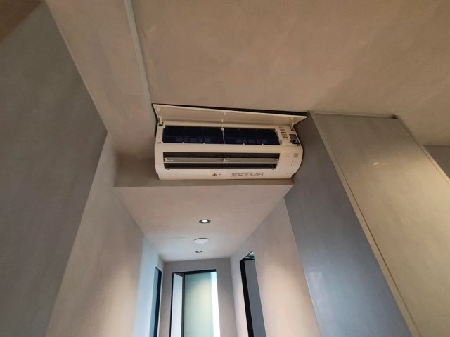 A mini-split unit crammed into a tight space.