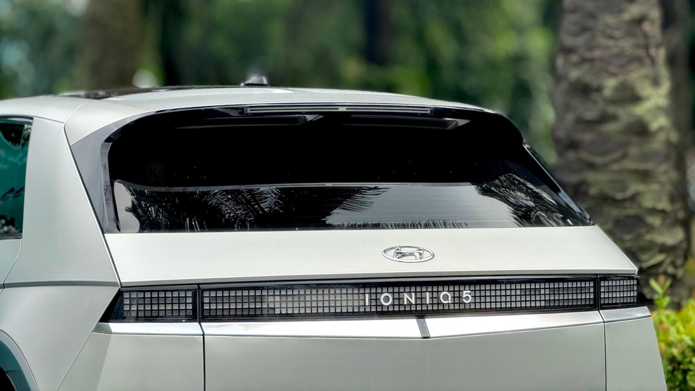 A Hyundai Ioniq 5 parked among greenery.