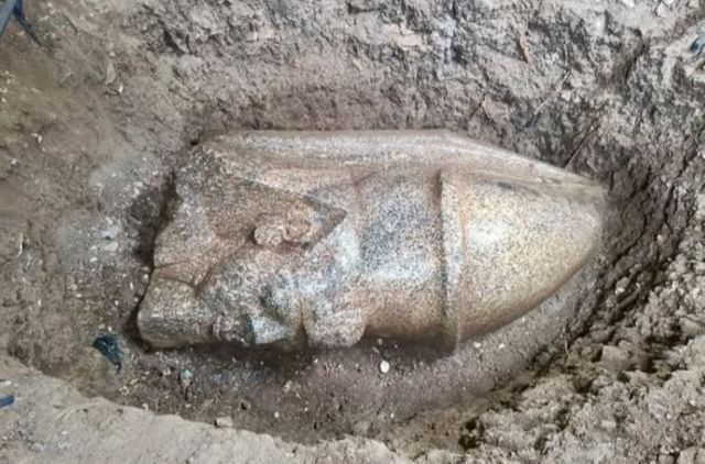 Inscribed stone found outside Egyptian home leads archaeologists to remains of giant royal statues