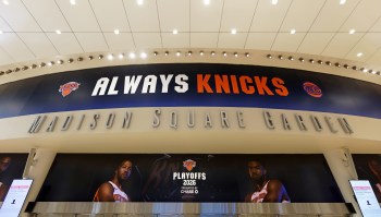A large sign reading "ALWAYS KNICKS" at Madison Square Garden, promoting the 2026 playoffs.