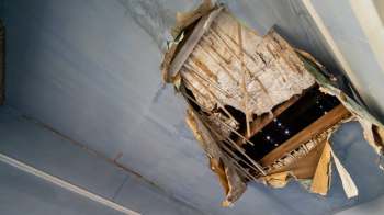 A large hole in a ceiling.