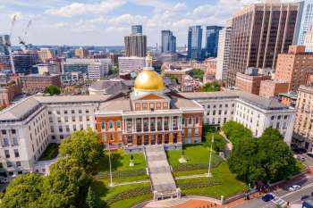 Massachusetts State House Capitol building in Boston with the city in the background