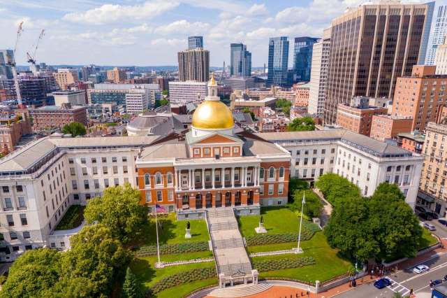 Massachusetts State House Capitol building in Boston with the city in the background