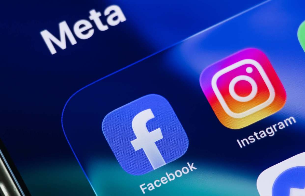 Logos of Facebook and Instagram displayed on a smartphone screen with the Meta brand name above.