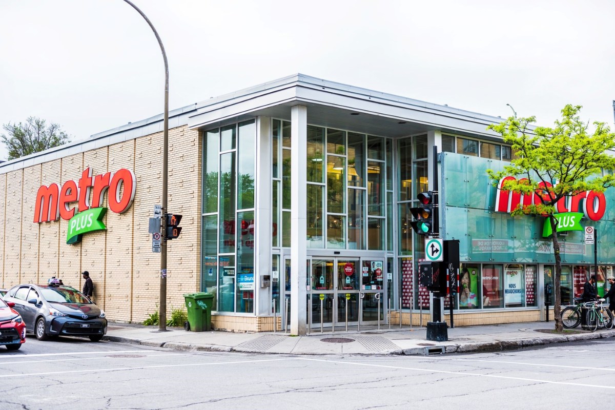 A grocery store with large glass windows and a red sign reading "Metro Plus."
