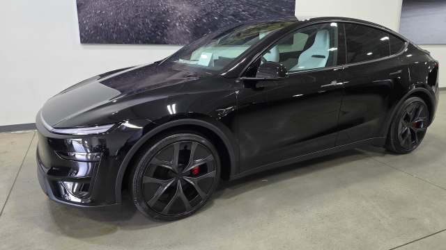 A black Tesla Model Y.