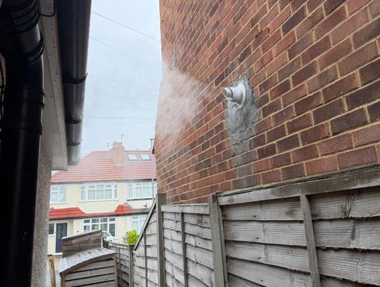 Steam venting from a house.